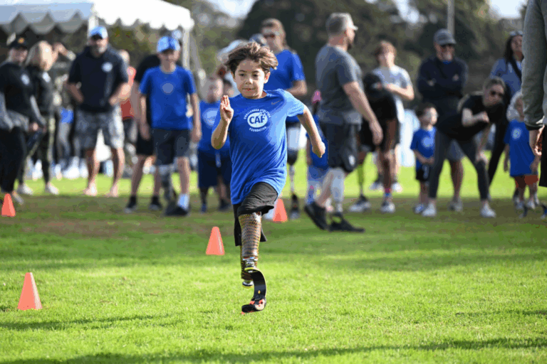 Youth athlete Micah Magana at a running and mobility clinic in san diego with a prosthetic leg