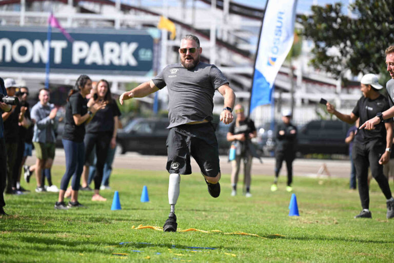 CAF Ambassador Travis Ricks running obstacle course at Ossur running and mobility clinic.