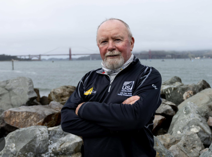 Photo of Jim Thweatt with bay behind him
